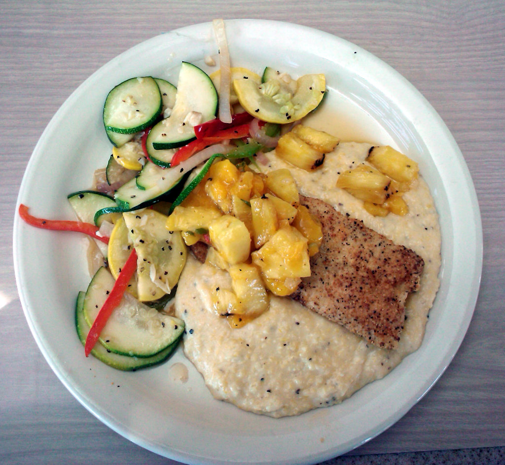 Lemon pepper mahi-mahi with pineapple-mango salsa over stone ground grits from Locklear's Beach City Grill at the Folly Beach Fishing Pier on Folly Beach