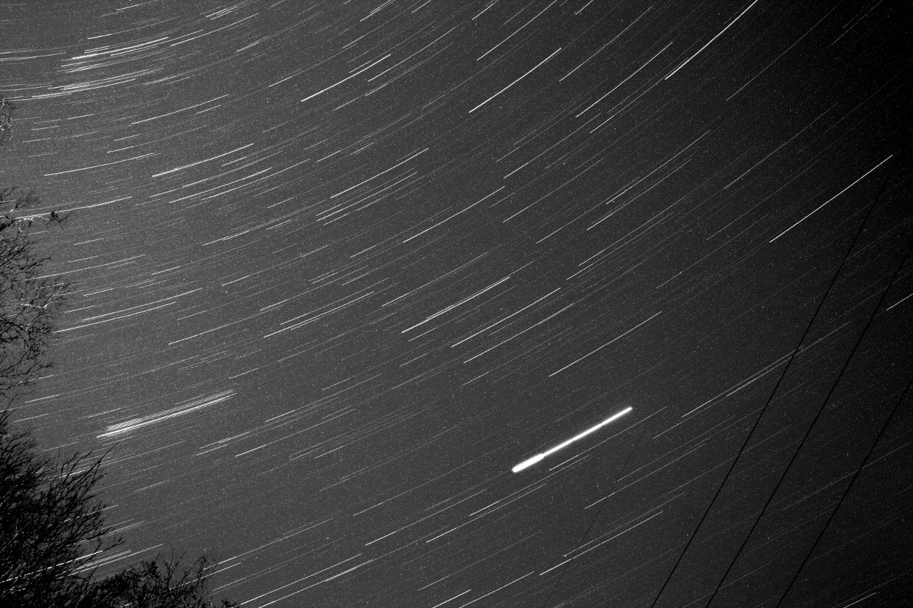 A photo of star trails composed by stacking shorter duration photos