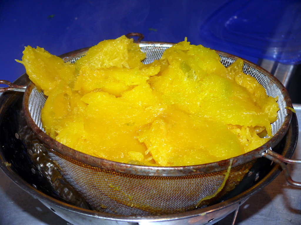 Colander filled with roasted pumpkin.