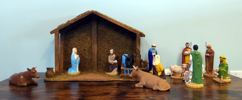 Mary and Joseph have arrived at the stable. A few shepherds are hanging around tending to their animals.
