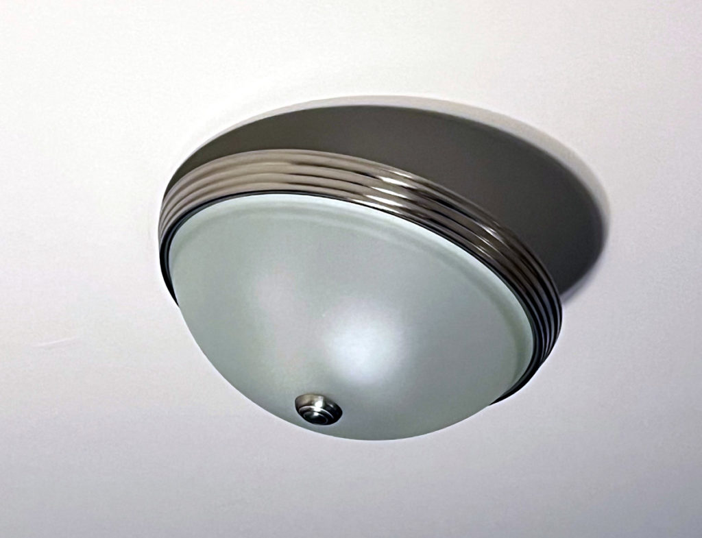 Ceiling light fixture dangling from the ceiling.