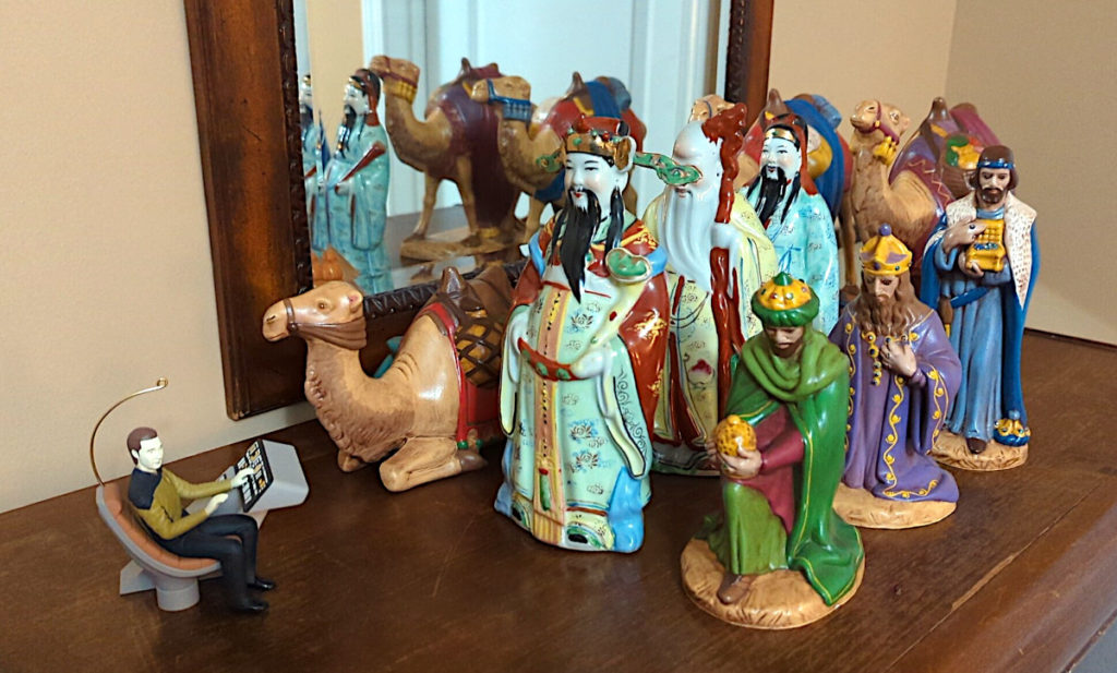 A Data Star Trek ornament leading an away team of ceramic wise men figurines.