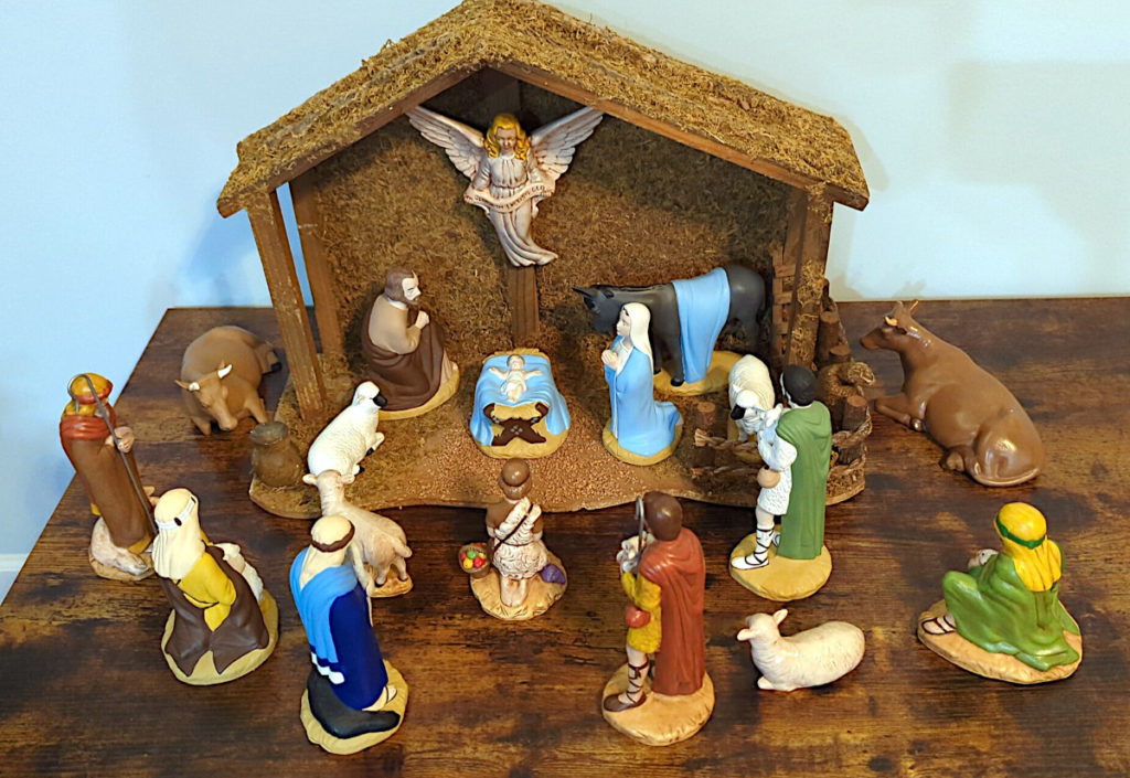 Christmas nativity scene with ceramic figurines.