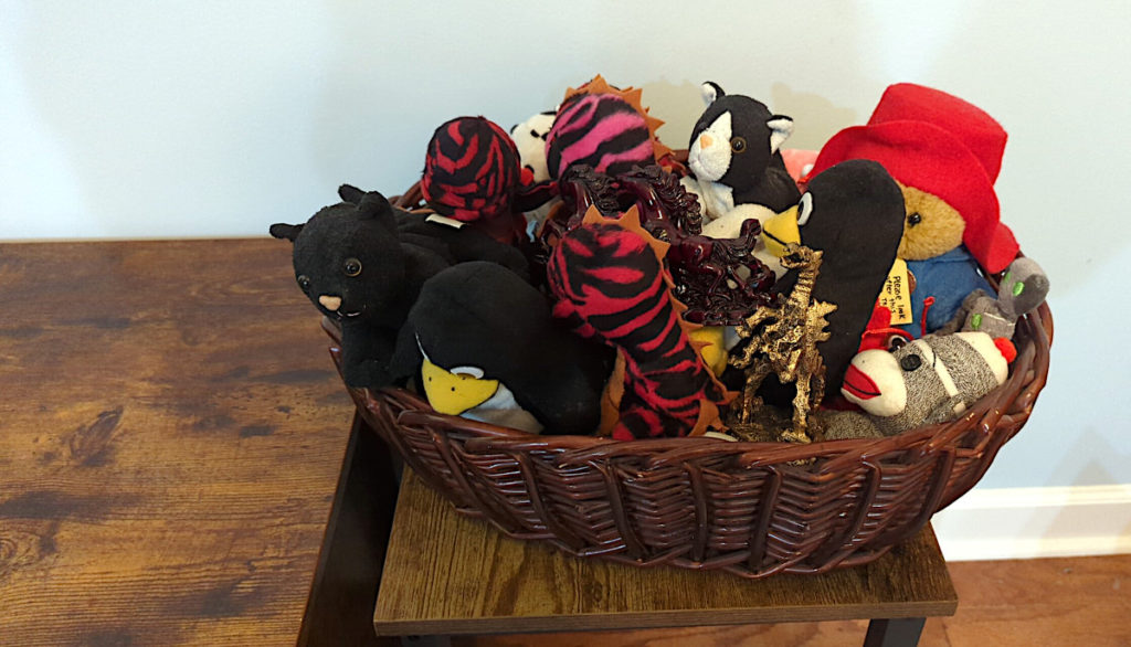 Stuffed animals in aa woven basket arriving at the stable