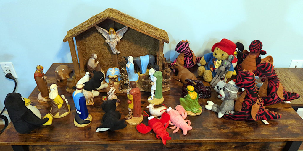 Stuffed animals have joined the shepherds and the sheep and the cows at the stable to see the new baby.