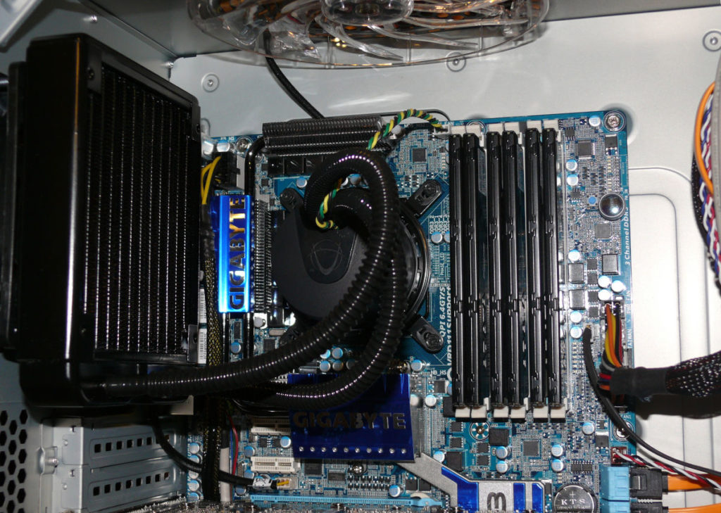 Looking at the upper portion of the case showing the mother board, CPU cooler and RAM slots